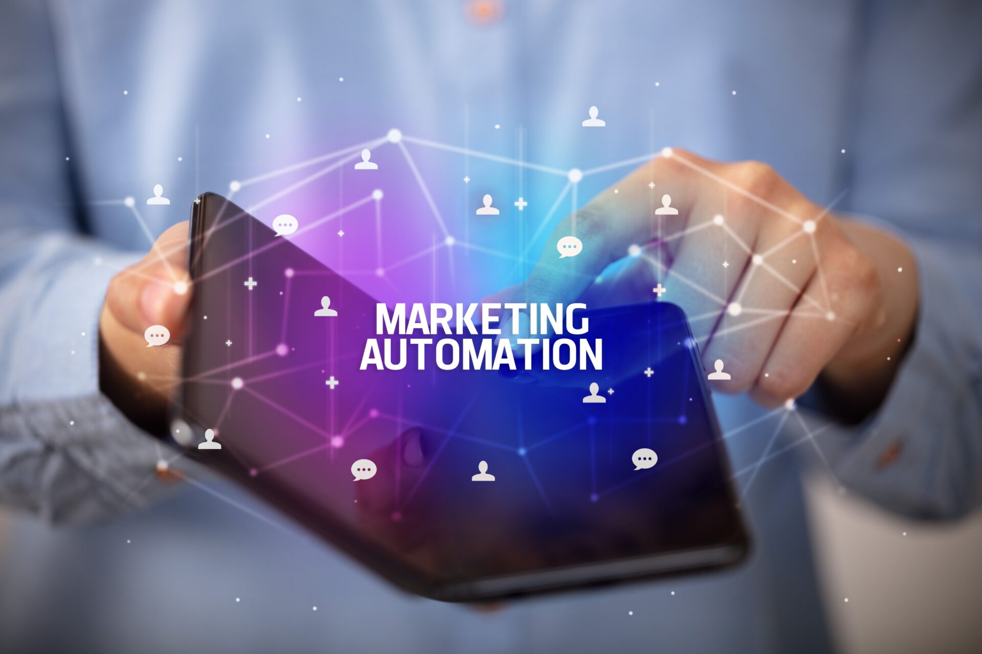 A person using a tablet with the text "Marketing Automation" and digital icons representing communication and connections in the background. 